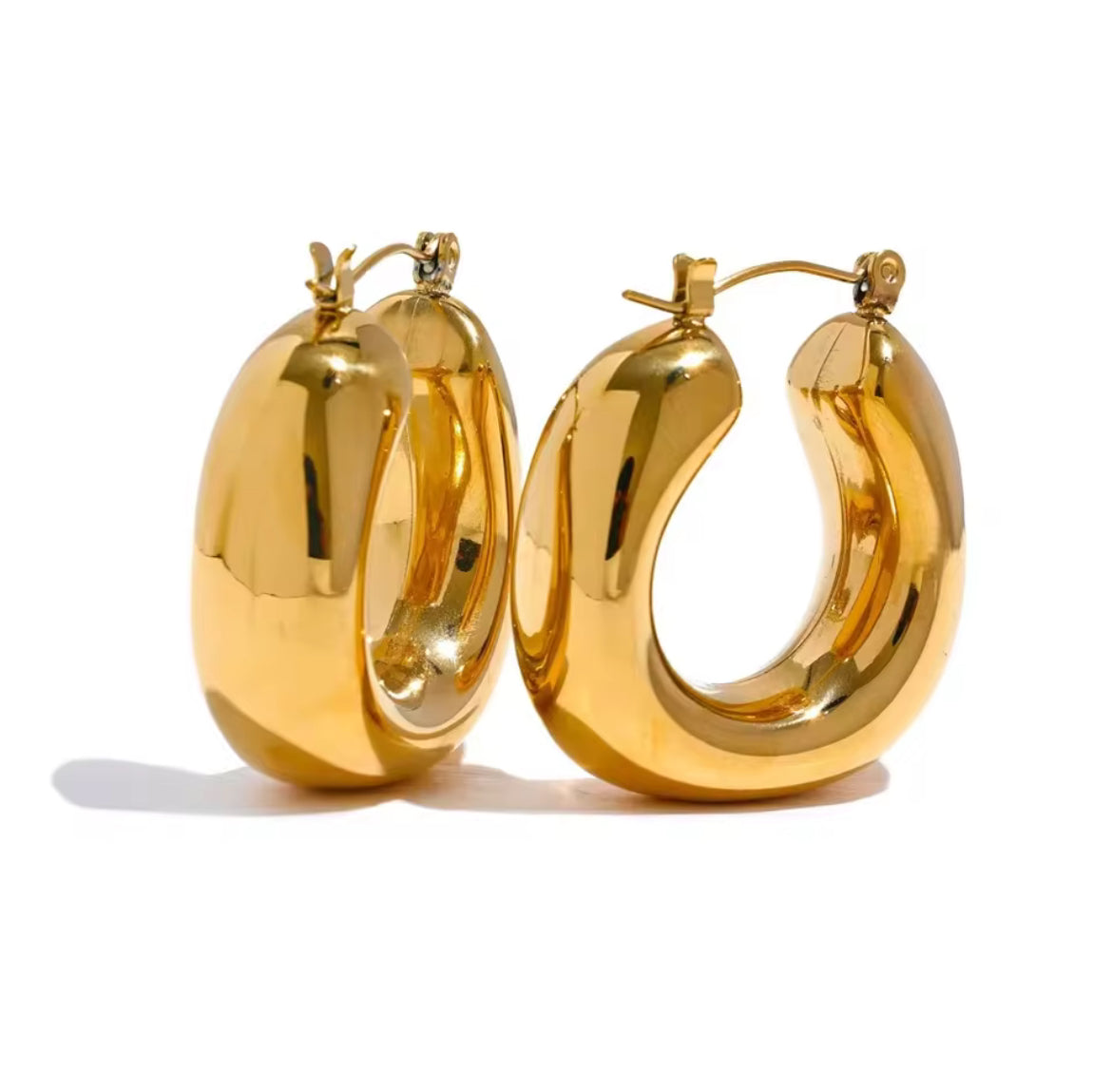 Gold hoop earrings on a white background