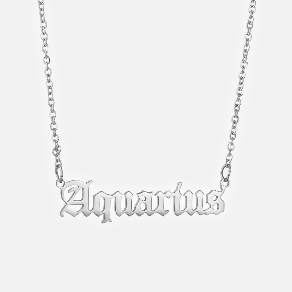 A silver stainless steel necklace with the word 'Aquarius' written in gothic font on a chain.