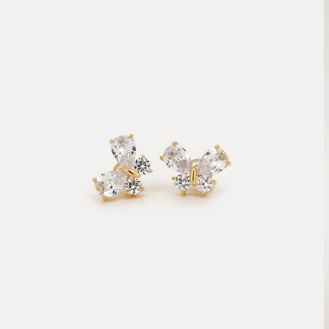 Gold butterfly earrings with faceted crystal wings, front view