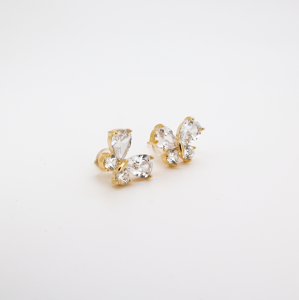 Side view of gold butterfly earrings with faceted crystal wings