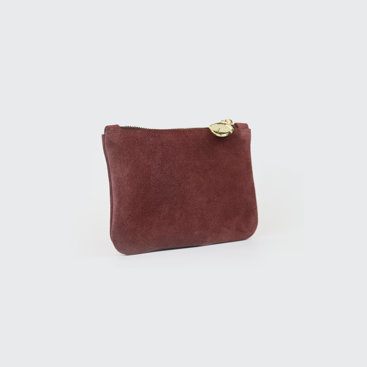 Side view of mauve suede coin pouch