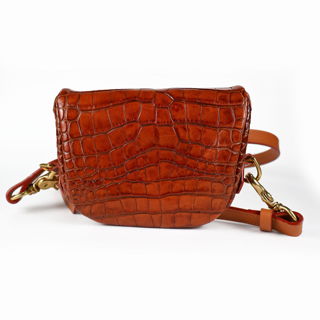 A brown crocodile press leather Amara Petite Bum Bag displaying the back of the bag 