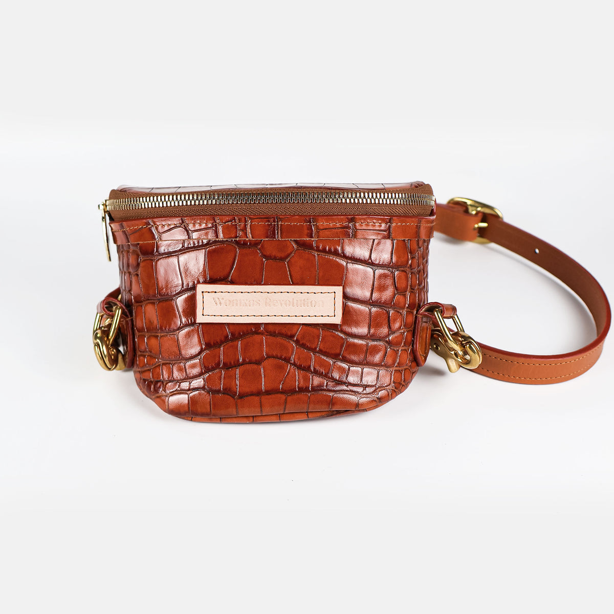 Small brown croc-embossed leather crossbody bum bag with gold zipper and hardware on a white studio background