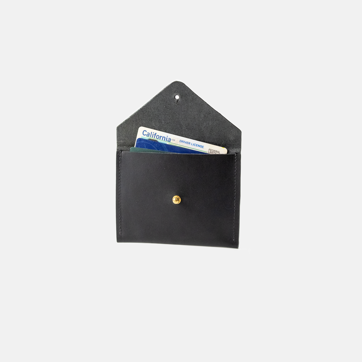 Black leather wallet with a card inside on a white background