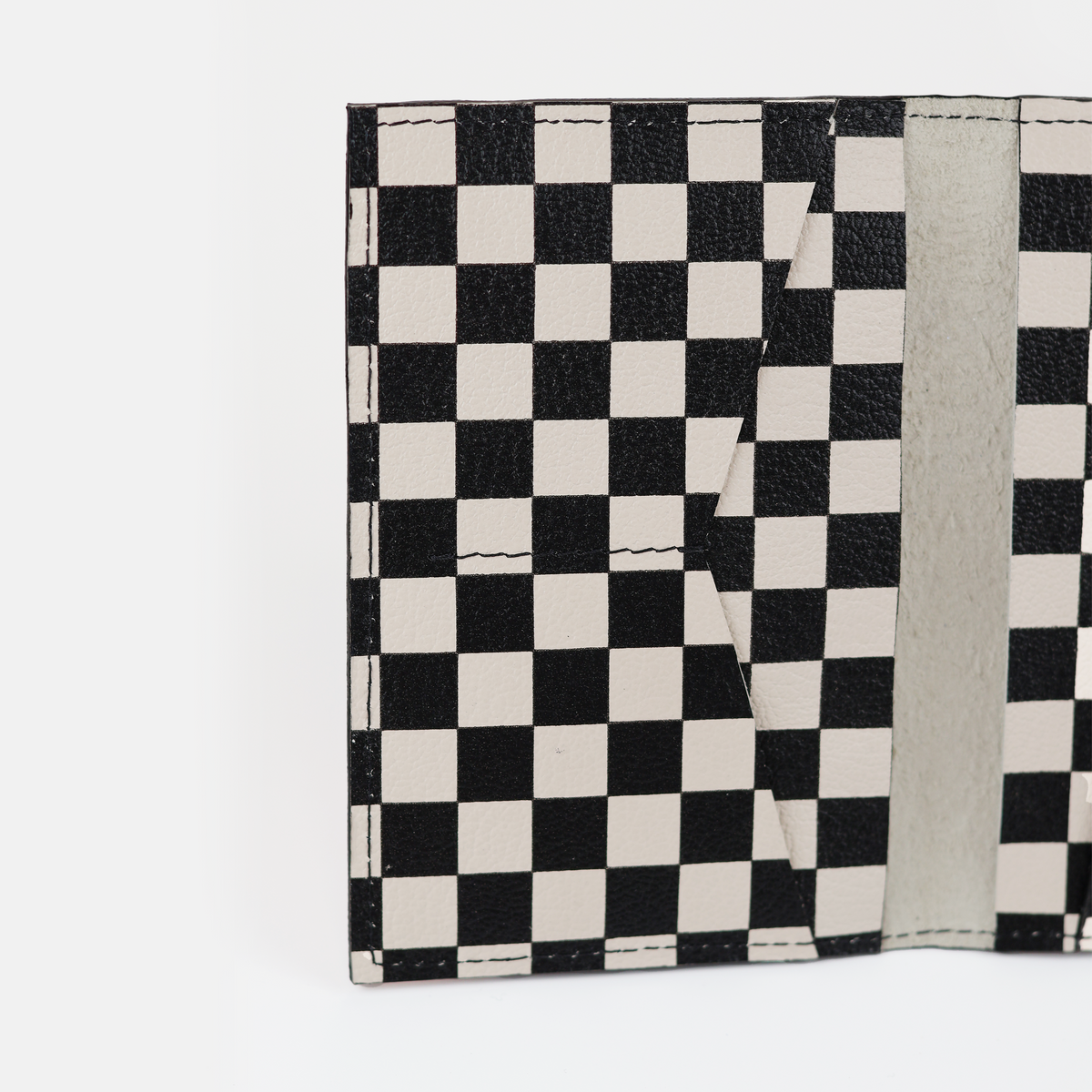 Card slots inside the checkered leather passport cover