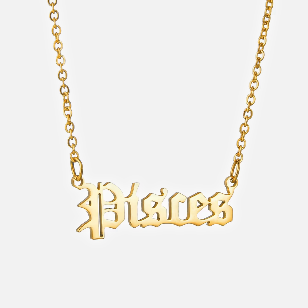 A gold-plated stainless steel necklace with the Pisces zodiac sign in a gothic font on a chain.