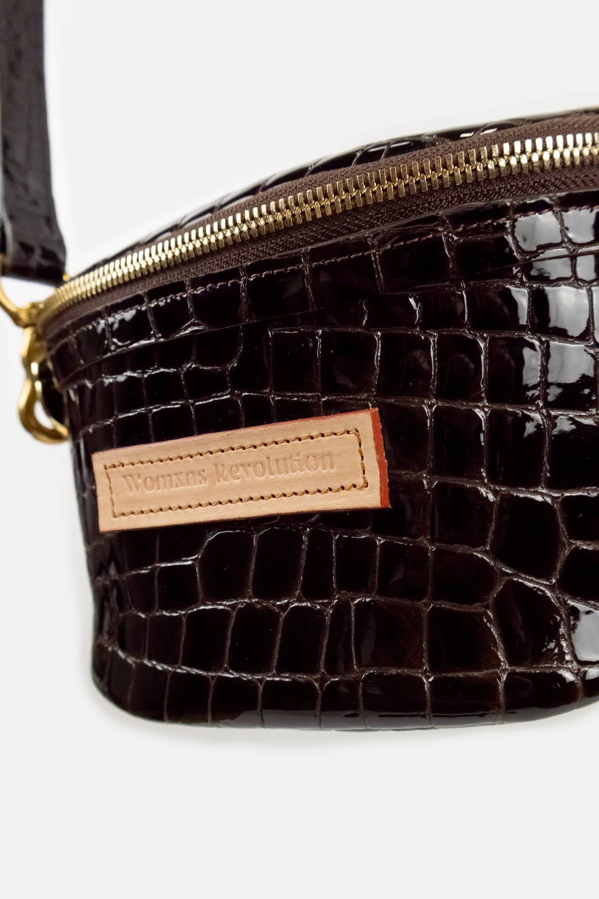 Dark Brown crocodile-patterned handbag with a visible brand label on a white background